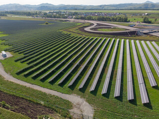 Fototapeta na wymiar Aerial view of solar panels plant. Concept of clean and renewable energy.