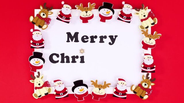 Christmas stickers appear on frame with Merry Christmas text. Stop motion