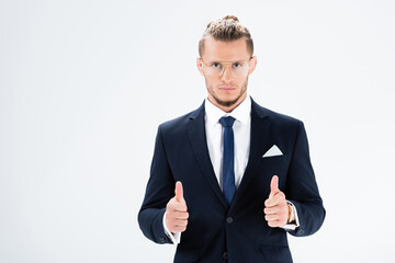  businessman in suit and glasses showing thumbs up isolated on white