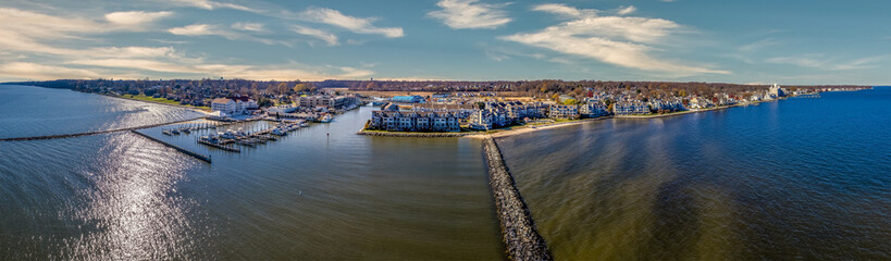 Aerial view of Chesapeake Beach marina with luxury sail boats, beach house apartments, fishing boats near the water park popular vacation spot for Washington residents in Calvery county Maryland