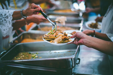 Volunteers Share Food to the Poor: concept of poverty in Asian society