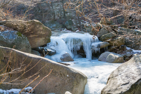 Snow and fronzen river with forest at the valley of Bukhansan Mountain national park in Seoul of South Korea.