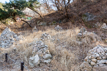 Piles of rocks, withered tree the Bukhansan Mountain national park in the spring in Seoul of South Korea