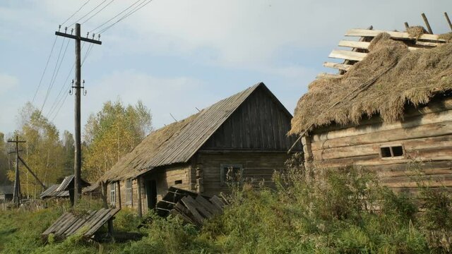 Old fashioned vintage wooden retro abandoned village countryside dacha house straw roof world war two World War II former USSR CIS Belarus partisan guerilla fight battle for freedom history historic
