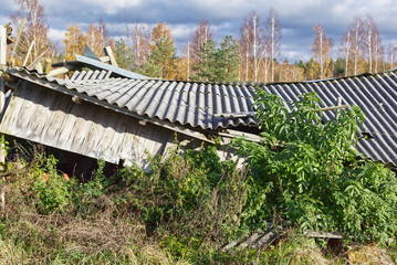 Old and very dangerous asbestos roof. Asbestos dust in the environment. Health problems