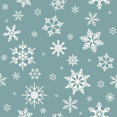 Fototapeta na wymiar Winter seamless pattern with flat white snowflakes on powder blue background