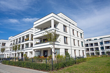 Fototapeta na wymiar Modern white apartment houses in a development area in Berlin, Germany