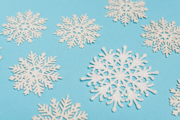 top view of winter snowflakes on blue 