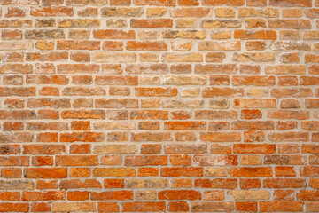 Background from an old and worn orange brick wall