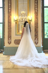 The bride is walking with her back