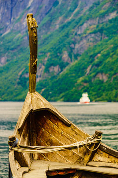 Old viking boat and ferryboat on fjord, Norway