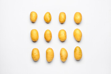 Raw potatoes on white background