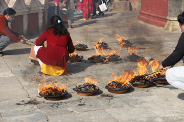 Wax Diyas with selective focus with a circular arrangement. Houses are decorated with small Diyas placed at boundaries and entrances during the festival of light Diwali in Nepal.
