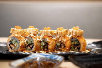 Maki sushi salmon roe on top with tamako