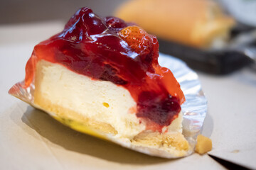Bite cheesecake with fresh berries and sweet strawberry sauce