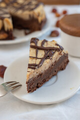Fototapeta na wymiar Delicious chestnut cake with almonds and chocolate glaze