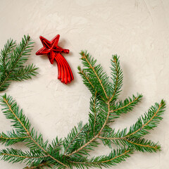 Christmas festive background. New Year cards. Fir branches, garlands, cones, Christmas toys on a textured wooden background. View from above. Place for your text.
