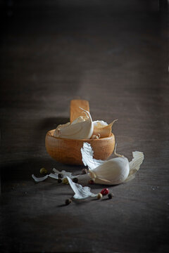 Garlic cloves with a wooden spoon
