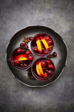 Mulled wine with cranberries, cinnamon, orange slices and star anise