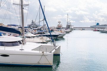 Fototapeta premium Speed boats at harbor. Power boats moored in marina. Sea coast pier.