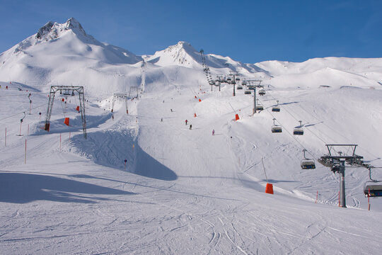 Winter landscape in the Alps. Mayrhofen sports region in the Zillertal. Ski slopes in the background of mountains