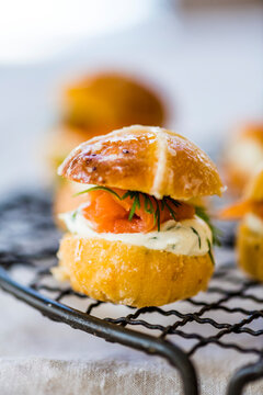 Savoury Hot Cross Bun Burger With Salmon And Cream Cheese