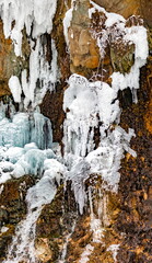 Icicles of ice from falling water in winter