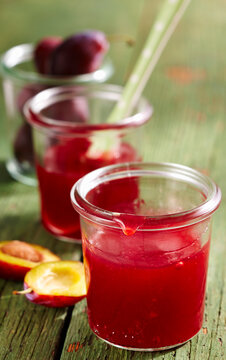 Homemade damson syrup in preserving jars