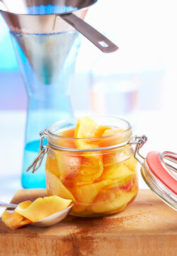 Papaya preserved in rum and liqueur with honey in a jar