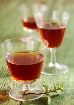 Homemade peppermint liqueur with wine spirit, mint, nutmeg, cloves, orange and sugar