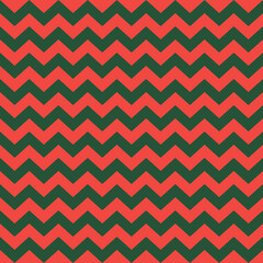 Zig zag Christmas and new year pattern. Regular chevron stripes of red and green color. Classic zigzag lines abstract geometry background. Seamless texture print. Vector illustration