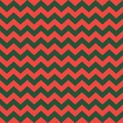 Zig zag Christmas and new year pattern. Regular chevron stripes of red and green color. Classic zigzag lines abstract geometry background. Seamless texture print. Vector illustration