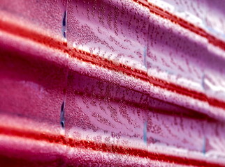 Metal roof in dew in the morning in summer