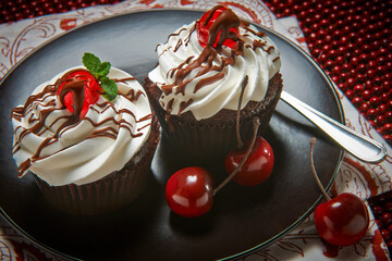 Chocolate cupcakes with cherries