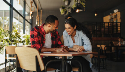 Smiling couple at coffee shop