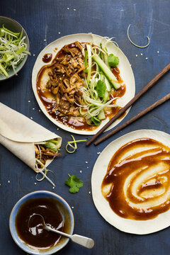 Vegan Chinese Jackfruit 'duck style' pancakes being made on a dark blue background