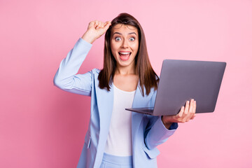 Photo of young girl excited surprised happy smile news discount hold laptop hand touch glasses...