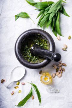 Vegan wild garlic pesto being made in a mortar