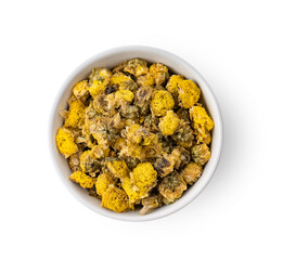 dried chrysanthemum flowers in white bowl isolated on white background