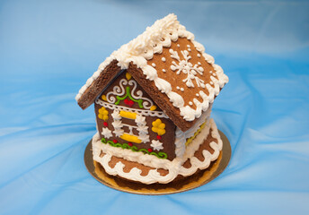 A house made of gingerbread on a blue background