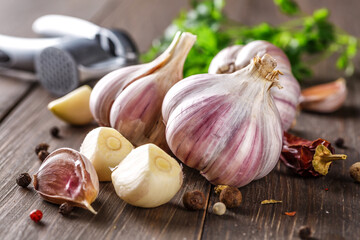 Closeup of Garlic bulbs on wooden table with garlics blur background.A set of fresh garlic on the chest wooden background.