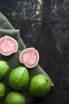 Guavas, whole and halved