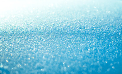 Obraz premium Blue snow sparkling festive background. Abstract Christmas for card or invitation.