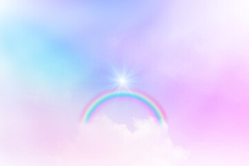 The Rainbow sky is Colorful sky with Soft clouds and a rainbow crossing. Fantasy magical sunny sky pastel background is fluffy white cloud. Freedom wallpaper concept. Sweet color dream.