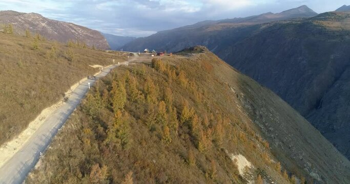 Aerial view of tourist car going to the observation deck of Katu Yaryk mountain pass (1200 meters above sea level), Altai Republic, Russia