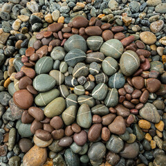 A spiral made of pebbles on the beach