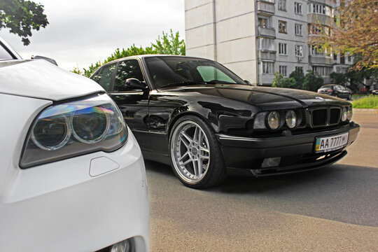 Kiev, Ukraine - May 17, 2014: Combo BMW. Two BMW - black and white. BMW (F10) and M5 (E34) in the city