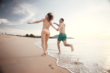 loving couple on the beach / summer vacation, sea coast, love, romantic vacation at sea