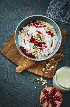 A Bowl Of Pomegranate Granola With Yoghurt