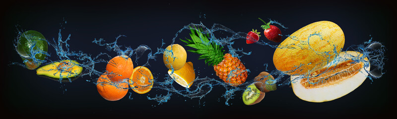 Panorama with fruits in water - juicy avocado, orange, lemon, pineapple, kiwi, strawberry, melon...